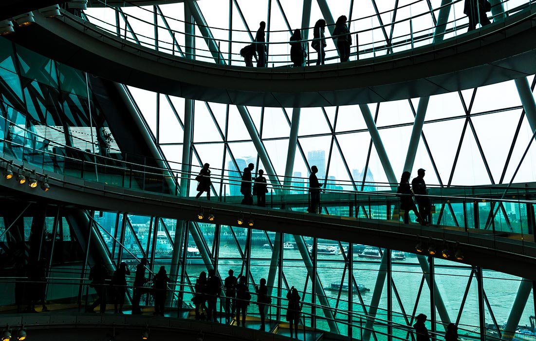 JAGGAER Supplier Network - People Walking on a Circular Stairway